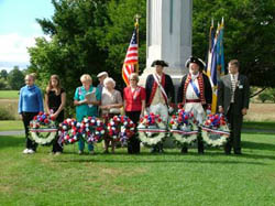 (L-R) Corinne Hare, Schuyler Society, C.A.R,; Jessica Wilson, Bemis Heights Society, C.A.R.; Nancy Rodenmacher & Eleanor Kenyon, Schenectada Chapter, NSDAR; Marion Walter, Saratoga Chapter, NSDAR; Peter Goebel, Empire State Society, SAR; Henry McCarl, National Society, SAR; Richard Fullam, Saratoga Battle Chapter, SAR -- Photo by Charles Walter, IV