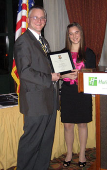 Rich receives certificate from Lexi - Photo: Duane Booth