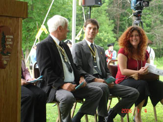 Past President Duane Booth chats with President Goebel and Ms. McMullen before the ceremony