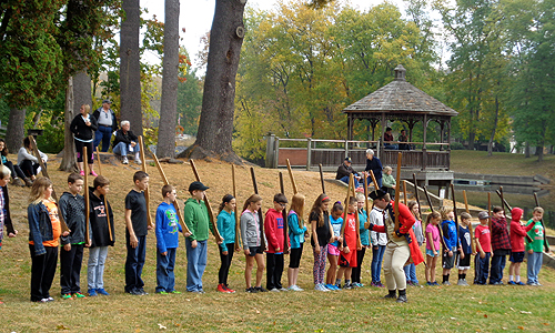 Students grounding their arms at the direction of Saratoga Park Ranger Eric Schnitzer