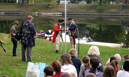 British General Burgoyne (Park Ranger Eric Schnitzer) surrendering to Continental General Gates (Sean Kelleher, the Saratoga Town Historian)