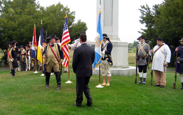 1st Chapter Vice President Primitivo 'Tivo' Africa receives the colors from General Gates