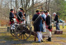Re-enactors ready their two pound artillery piece for firing - Photo by George Ballard