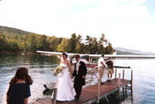 Jonathan and Ruth arrive at their reception in a seaplane.