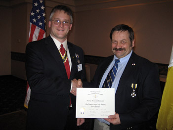 President Rich Fullam congratulates and welcomes George Malinoski to the Chapter (Photo Courtesy of Duane Booth)
