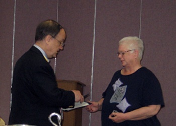 Kitty receives the Daughters of Liberty Award from President Sage