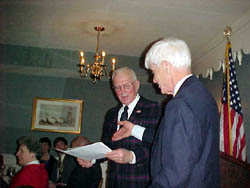 President Booth presents new member Joseph Insull Whittlesey with his Membership Certificate.