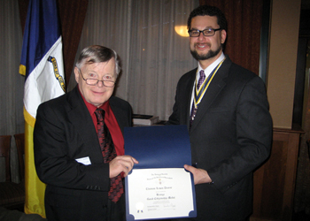 Tom receives Bronze Good Citizenship Award from President Africa