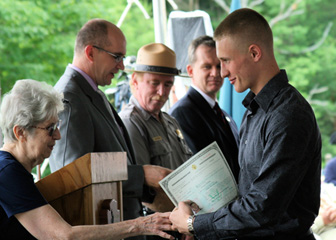 Larry presents Certificate & Doris Presents Gifts to a New American Citizen - Photo courtesy of Edwina Malinoski