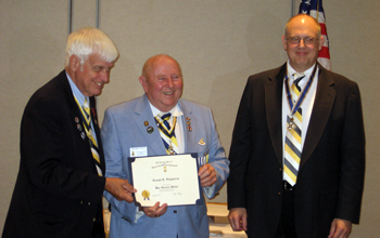 Capital VP Joseph Fitzpatrick receiving the War Service Medal from ESS President Booth (L) and SBC President Gallant (R)