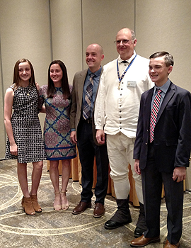 The entire Slocum family, Emily, Jennifer, Benjamin and Andrew, with President Gallant