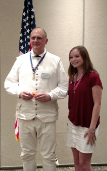 New York State C.A.R. President Bridget Lasky presents a 'Helping our Heroes' project pin to President Gallant